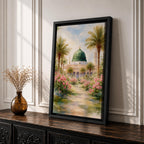 Framed canvas wall art of the Prophet’s Mosque in Medina featuring the iconic green dome, surrounded by palm trees and blooming pink flowers along a sunlit garden path, creating a peaceful and serene Islamic landscape scene for home decor.