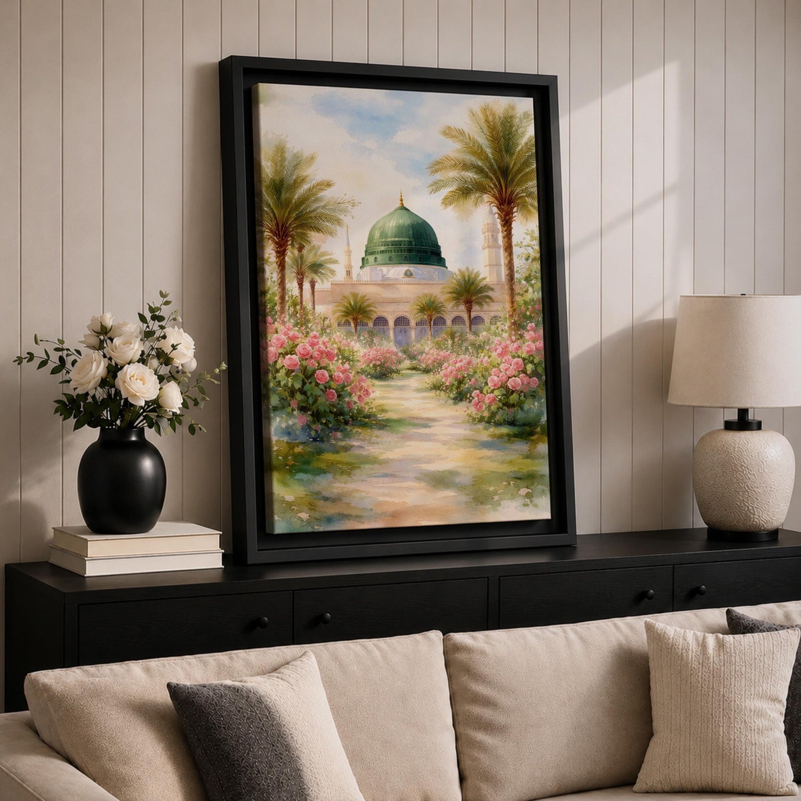 Framed canvas wall art of the Prophet’s Mosque in Medina featuring the iconic green dome, surrounded by palm trees and blooming pink flowers along a sunlit garden path, creating a peaceful and serene Islamic landscape scene for home decor.