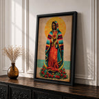 A vintage-style framed canvas depicting Our Lady of Guadalupe standing on a crescent moon surrounded by roses. She wears a traditional colorful mantle with a golden halo behind her head, holding a flaming heart. The artwork blends classic religious iconography with Mexican cultural elements.