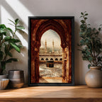 Artwork showing the Kaaba in Mecca viewed through an ornate Islamic archway with intricate carved stone details, overlooking the Masjid al Haram courtyard filled with pilgrims and surrounded by minarets and mosque architecture under warm sunlight.