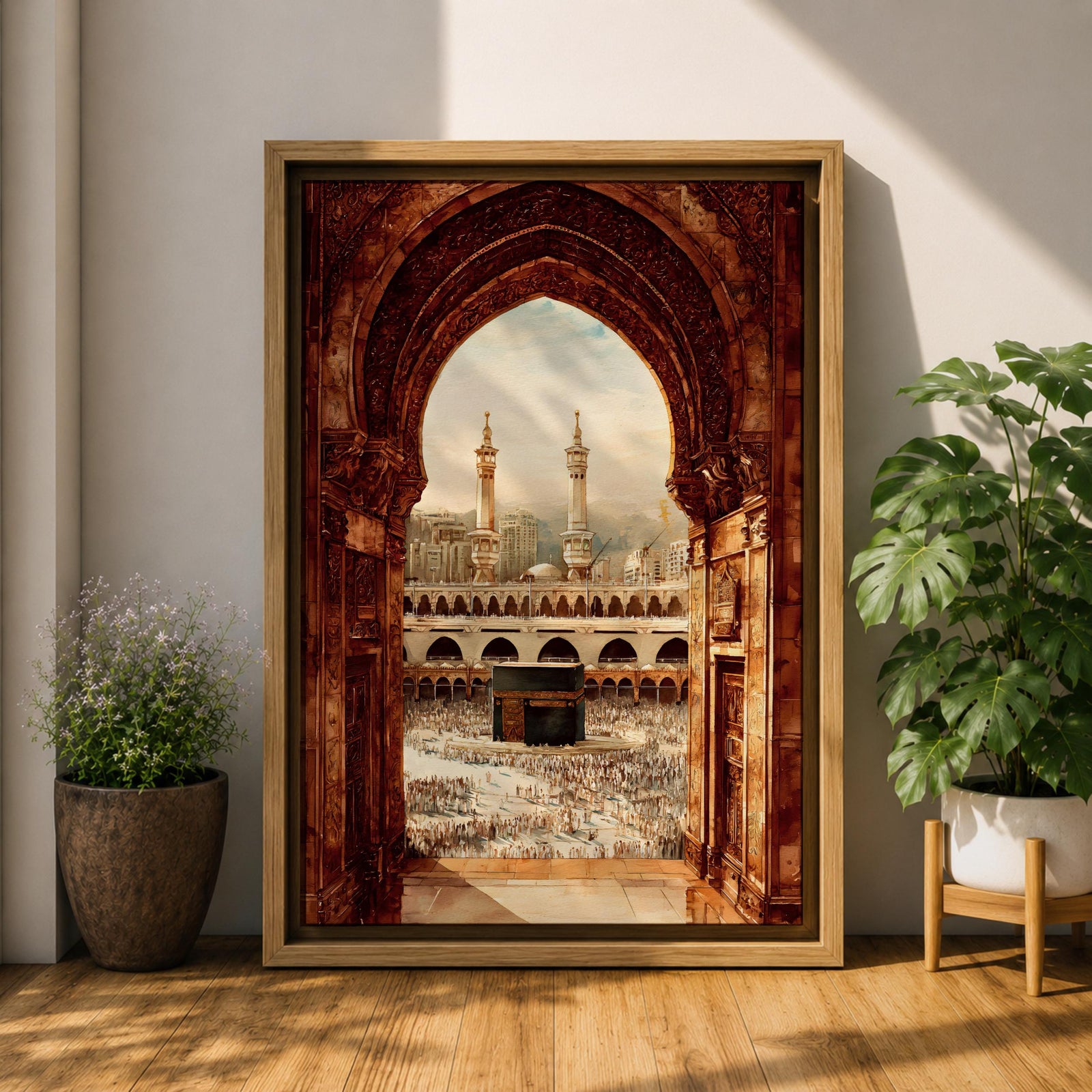 Artwork showing the Kaaba in Mecca viewed through an ornate Islamic archway with intricate carved stone details, overlooking the Masjid al Haram courtyard filled with pilgrims and surrounded by minarets and mosque architecture under warm sunlight.