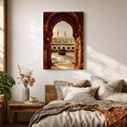 Artwork showing the Kaaba in Mecca viewed through an ornate Islamic archway with intricate carved stone details, overlooking the Masjid al Haram courtyard filled with pilgrims and surrounded by minarets and mosque architecture under warm sunlight.