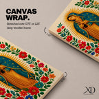 A framed stitched style art print depicting Our Lady of Guadalupe with hands clasped in prayer, surrounded by a radiant golden halo and vibrant floral embroidery in red, blue, and green. The image captures the traditional Mexican Catholic iconography with intricate textile detail and a serene expression.