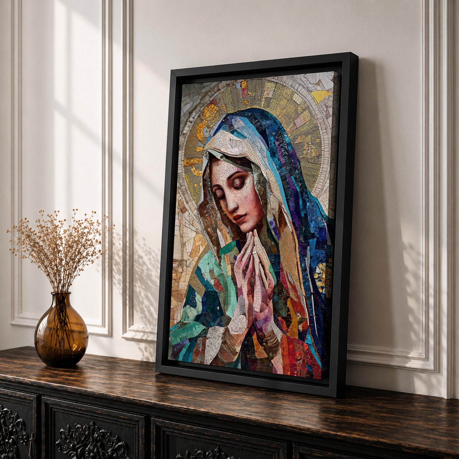 A mosaic-style artwork depicting Virgin Mary with hands clasped in prayer and eyes closed, wearing a blue and white veil with a golden halo behind her head. The piece uses intricate tile fragments to create a stained glass effect, emphasizing religious Christian themes with detailed textures and vibrant colors.
