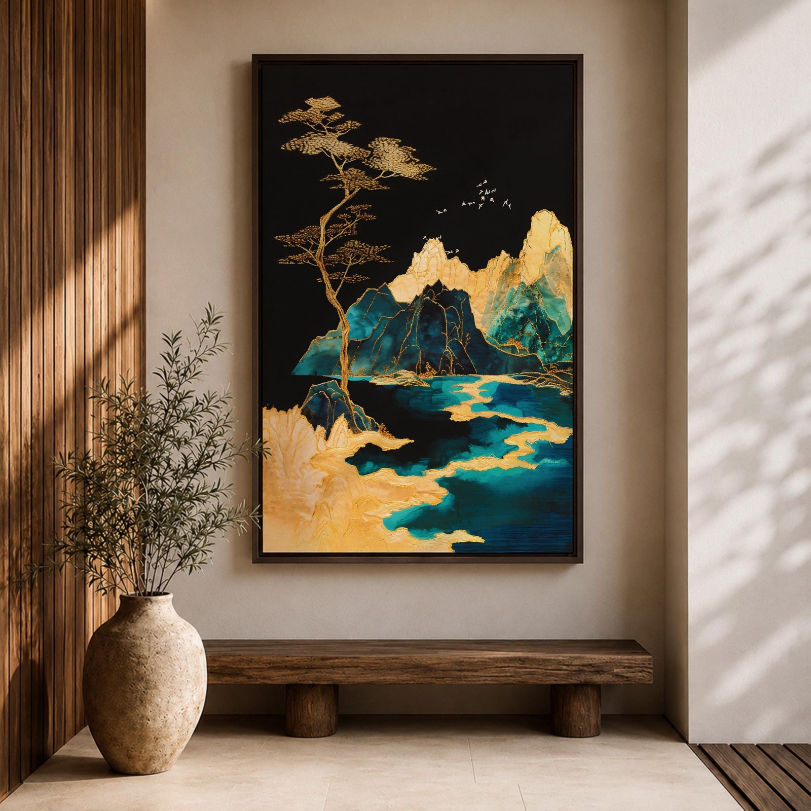A framed canvas artwork depicting a mountain landscape with abstract golden and teal elements. The composition features stylized mountains, a flowing river, and a tall tree with birds flying above, rendered in an abstract style with rich gold and blue tones against a dark background.