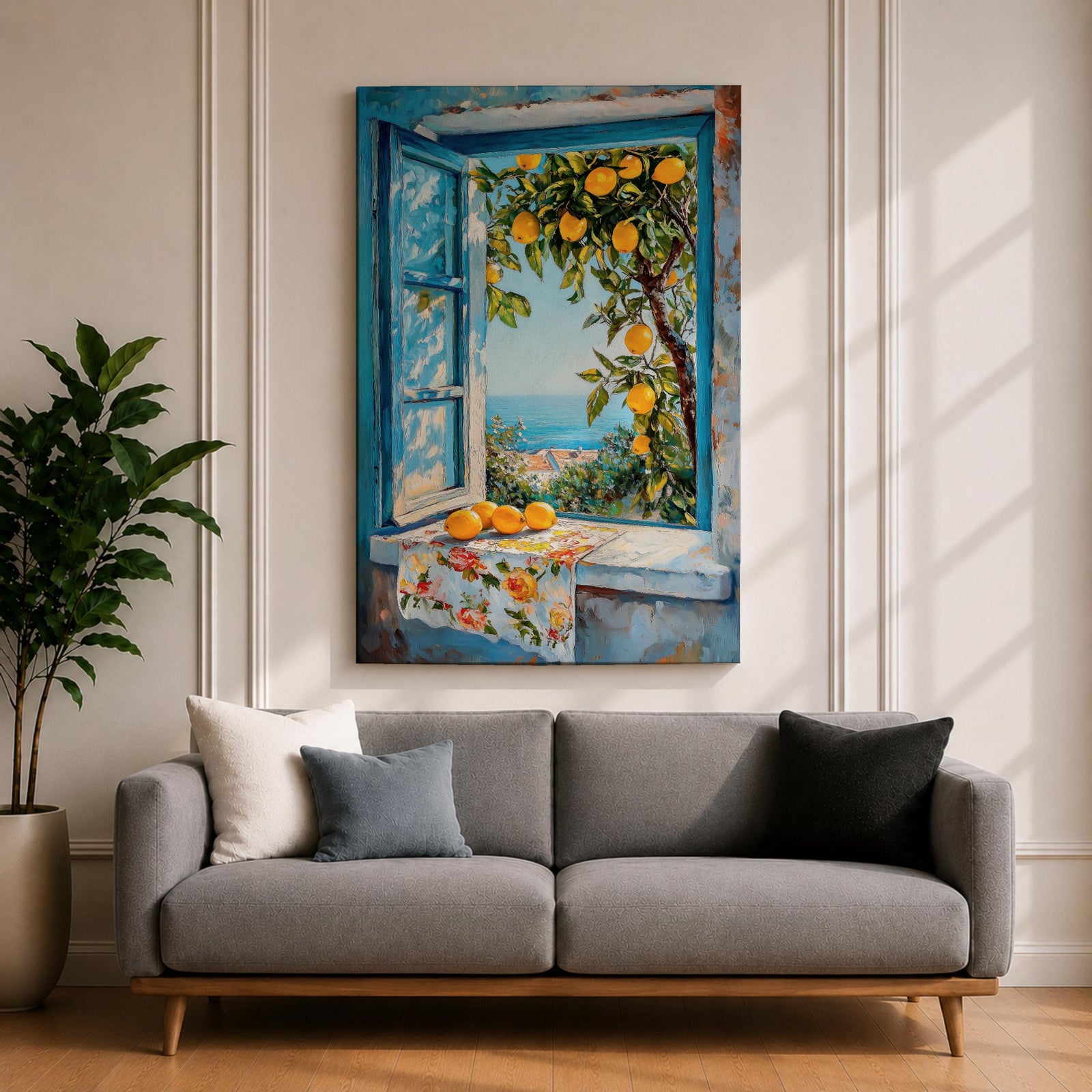 A vibrant framed canvas painting depicting a lemon tree bursting with ripe yellow lemons viewed through an open blue window overlooking a coastal Mediterranean scene. The artwork captures lush green leaves, a floral cloth on the windowsill, and a distant sea horizon in a realistic natural style.