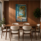 A vibrant framed canvas painting depicting a lemon tree bursting with ripe yellow lemons viewed through an open blue window overlooking a coastal Mediterranean scene. The artwork captures lush green leaves, a floral cloth on the windowsill, and a distant sea horizon in a realistic natural style.