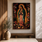 A detailed framed canvas print depicting Our Lady of Guadalupe, showing the Virgin of Guadalupe surrounded by a floral border with radiant light emanating behind her, rendered in a traditional Mexican religious art style with vivid colors and intricate floral patterns.