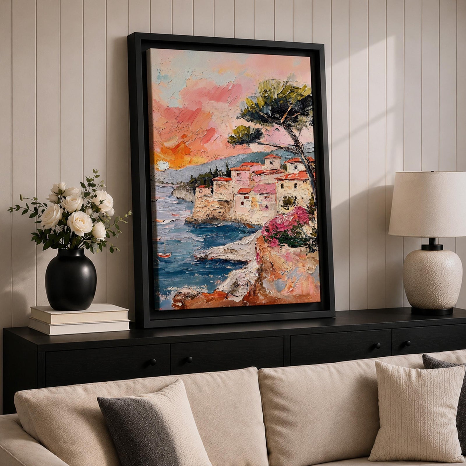 An impasto style painting depicting a Mediterranean village perched on rocky cliffs by the sea. The textured brushstrokes illustrate terracotta-roofed houses, a tall tree, and small boats floating on blue waters under a warm sunset sky, capturing a vibrant coastal landscape scene.