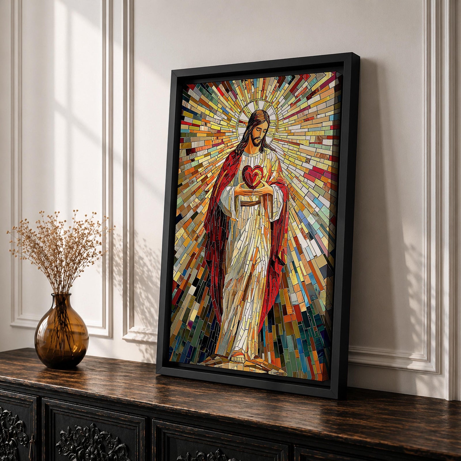A vibrant mosaic artwork depicting the Sacred Heart of Jesus with radiant geometric stained glass tiles. The figure is shown holding a heart with rays emanating outward, framed in wood, combining traditional religious iconography with a colorful mosaic style.