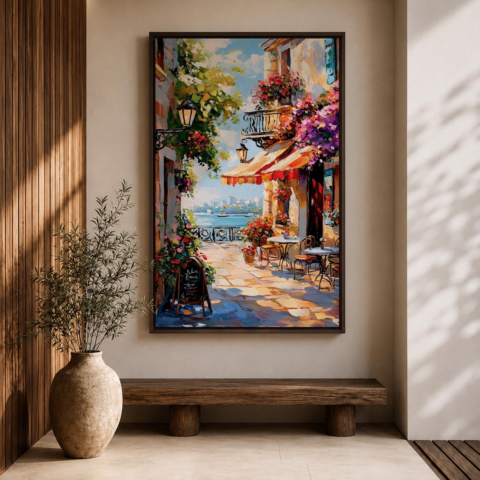 A vibrant Mediterranean café scene featuring a cozy outdoor patio with tables and chairs, colorful flowers cascading from balconies, and a distant view of the sea. The artwork captures a lively coastal atmosphere with impressionistic brushstrokes and rich textures, evoking a warm and inviting cityscape.