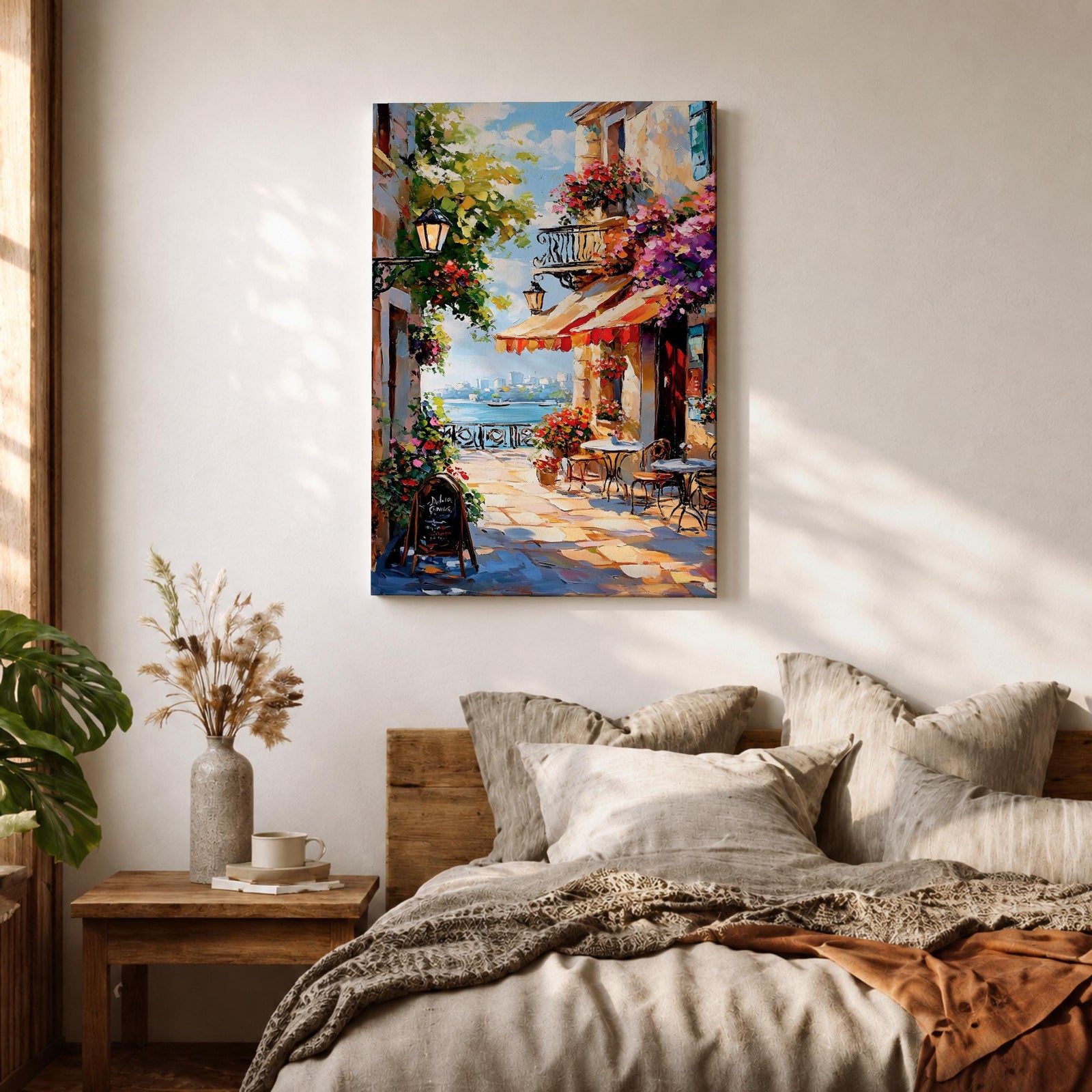 A vibrant Mediterranean café scene featuring a cozy outdoor patio with tables and chairs, colorful flowers cascading from balconies, and a distant view of the sea. The artwork captures a lively coastal atmosphere with impressionistic brushstrokes and rich textures, evoking a warm and inviting cityscape.