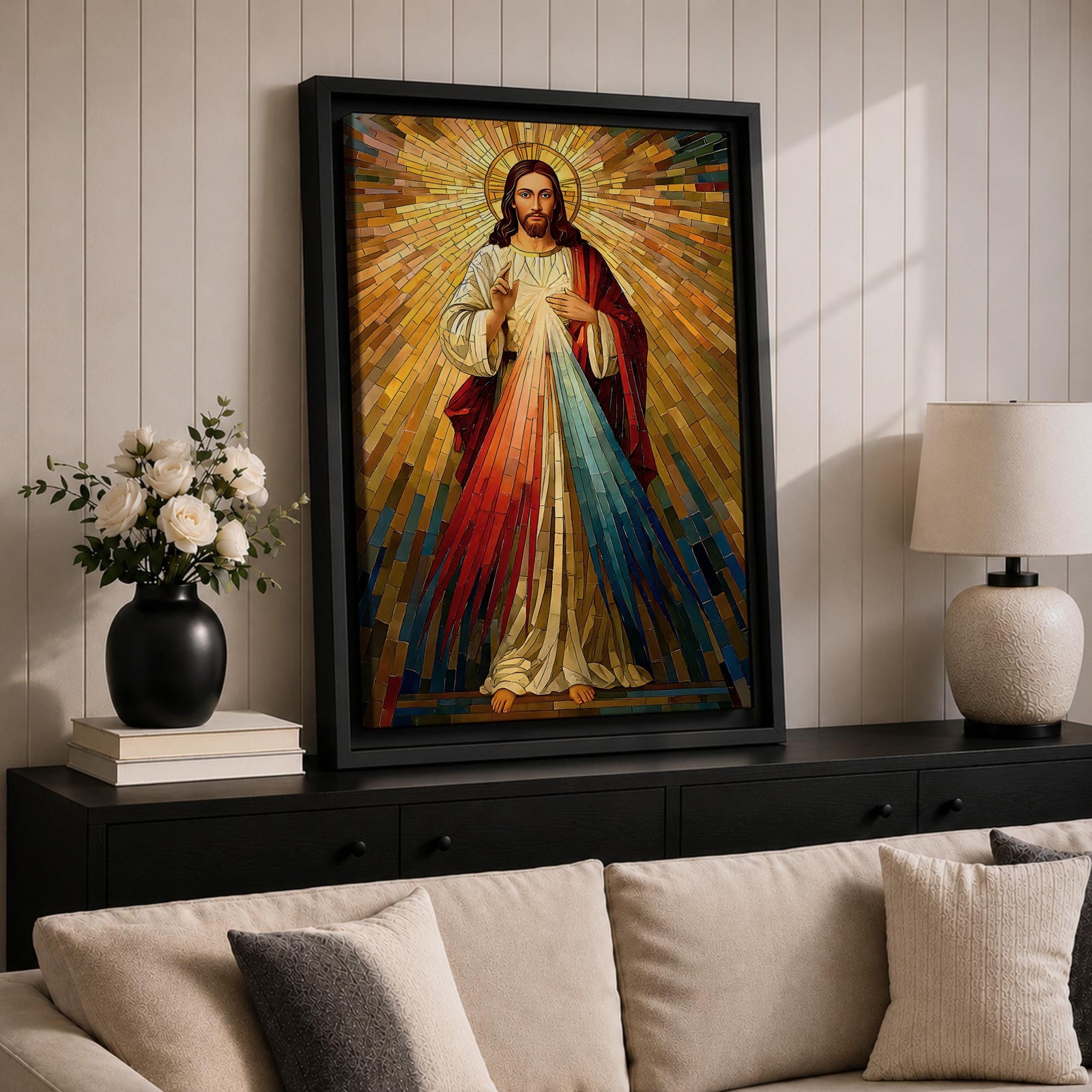 A mosaic style artwork depicting Divine Mercy of Jesus with radiant golden rays emanating behind him and red and blue beams flowing from his heart area, framed in a wooden frame, showcasing intricate tile-like geometric patterns and vibrant colors.