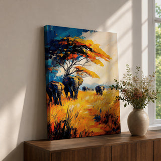 A vibrant impasto painting featuring a group of African elephants walking through tall golden grass under a large tree with colorful foliage. The textured brushstrokes emphasize the wildlife subject in a bold and dynamic style with rich blues, oranges, and yellows creating a striking natural scene.