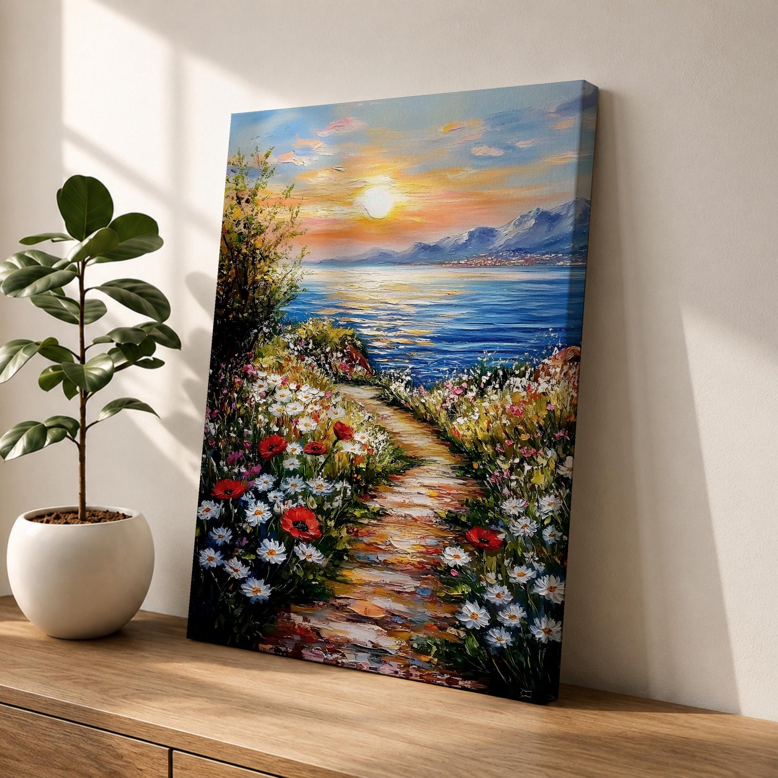 An impasto style framed canvas painting depicting a coastal sunset path bordered by vibrant wildflowers leading to a calm sea with distant mountains under a colorful sky. The textured brush strokes emphasize the natural landscape and seaside atmosphere.