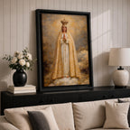 A detailed framed canvas painting of Our Lady of Fatima, depicting the Virgin Mary crowned and standing on clouds with hands in prayer, wearing a white and gold robe, rendered in a classic religious style with textured brushstrokes and a glowing background.