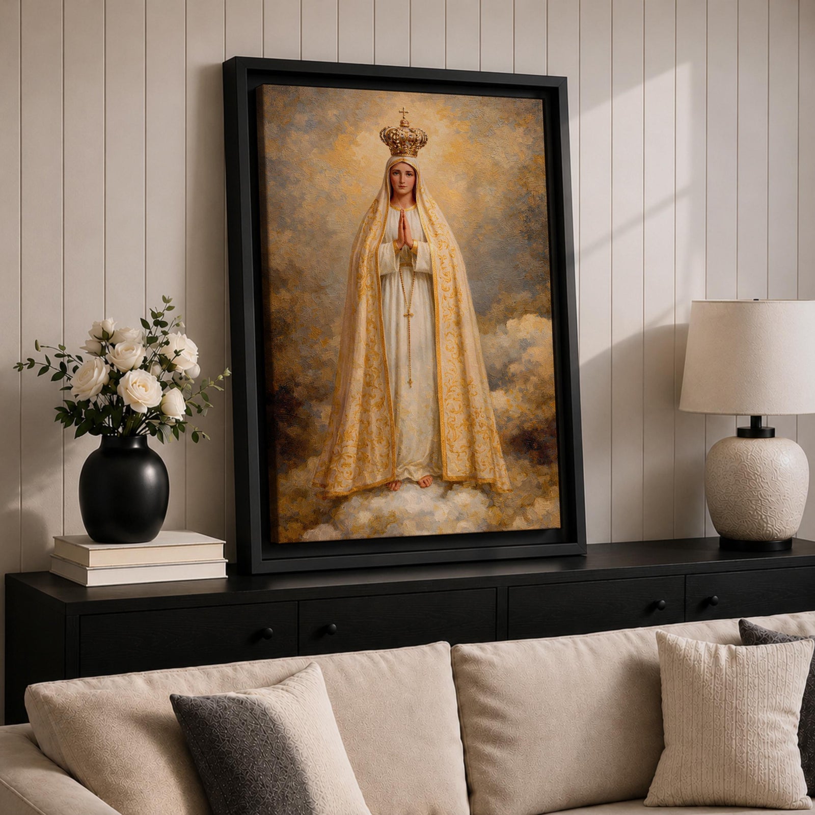 A detailed framed canvas painting of Our Lady of Fatima, depicting the Virgin Mary crowned and standing on clouds with hands in prayer, wearing a white and gold robe, rendered in a classic religious style with textured brushstrokes and a glowing background.