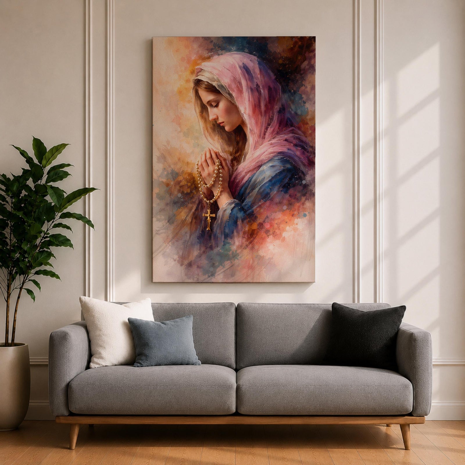 A watercolor style painting of the Virgin Mary wearing a pink hooded shawl, holding a rosary with a gold cross, her eyes closed in prayer, surrounded by soft, blended warm and cool colors creating a serene and contemplative atmosphere.