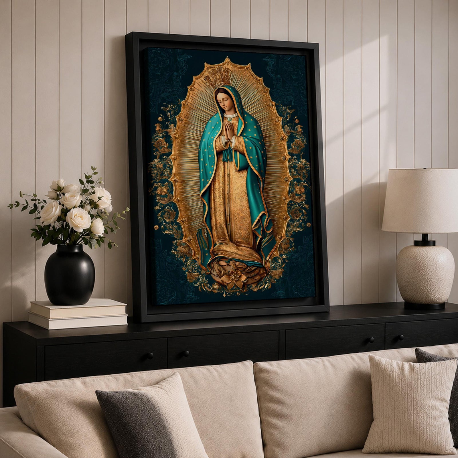 A detailed framed canvas artwork depicting Our Lady of Guadalupe standing with hands clasped in prayer, surrounded by a radiant golden aura and floral motifs, rendered in a traditional style emphasizing intricate patterns and symbolic elements.