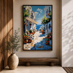 An impasto style painting depicting a charming Greek island village street with whitewashed buildings, colorful flowers in pots, balconies, and a view of the blue sea under a partly cloudy sky. The textured brushstrokes create a vivid Mediterranean coastal atmosphere.