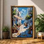 An impasto style painting depicting a charming Greek island village street with whitewashed buildings, colorful flowers in pots, balconies, and a view of the blue sea under a partly cloudy sky. The textured brushstrokes create a vivid Mediterranean coastal atmosphere.