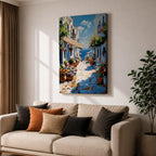 An impasto style painting depicting a charming Greek island village street with whitewashed buildings, colorful flowers in pots, balconies, and a view of the blue sea under a partly cloudy sky. The textured brushstrokes create a vivid Mediterranean coastal atmosphere.