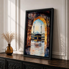 Watercolor-style painting of the Kaaba in Masjid al-Haram viewed through a large stone archway, showing the sacred courtyard with pilgrims and two tall minarets rising above the mosque.