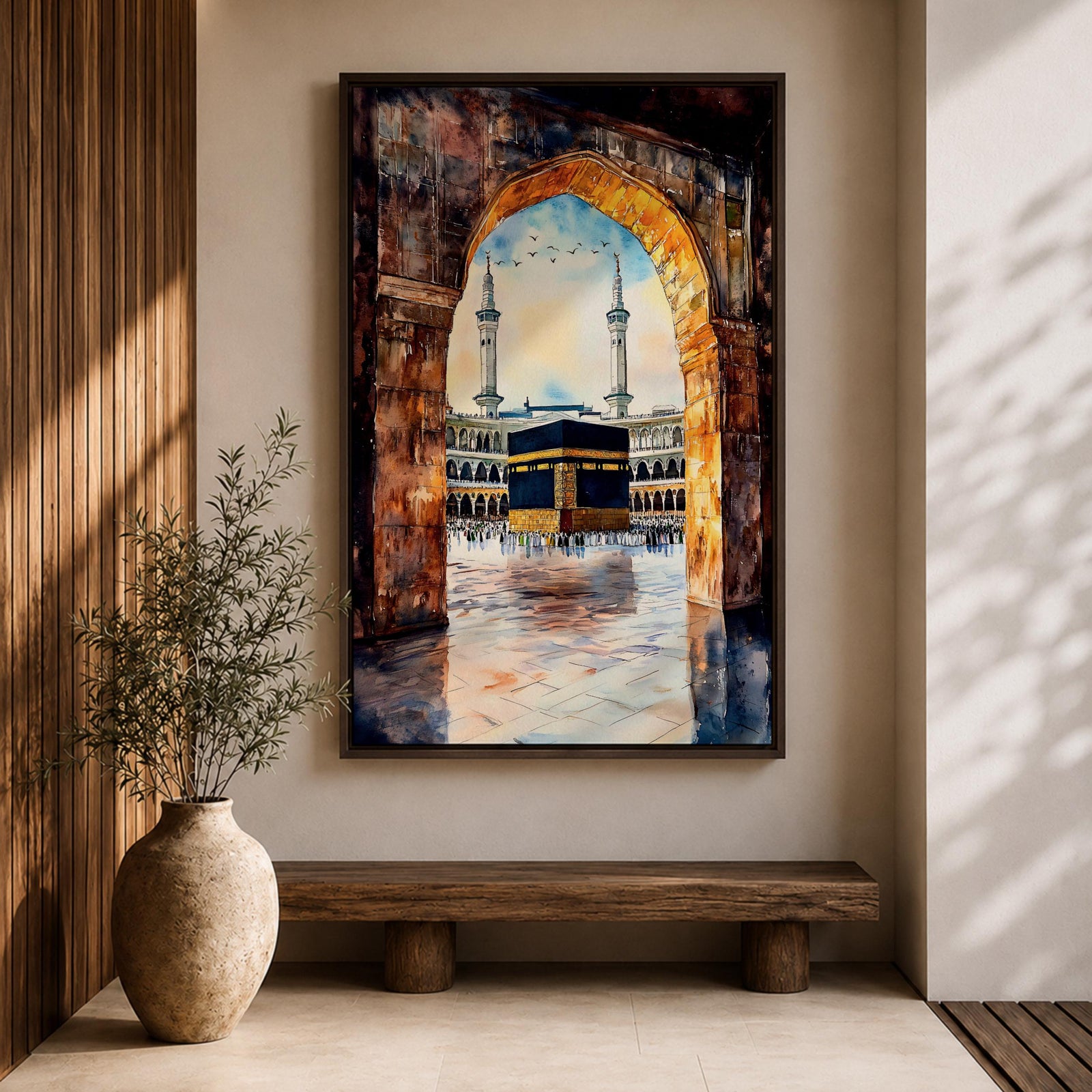 Watercolor-style painting of the Kaaba in Masjid al-Haram viewed through a large stone archway, showing the sacred courtyard with pilgrims and two tall minarets rising above the mosque.