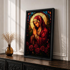 A stained glass style artwork depicting the Virgin Mary in a red robe with hands clasped in prayer, surrounded by a glowing halo and red roses at the bottom. The piece features intricate glass-like segments and rich colors, capturing a classic religious stained glass window aesthetic.