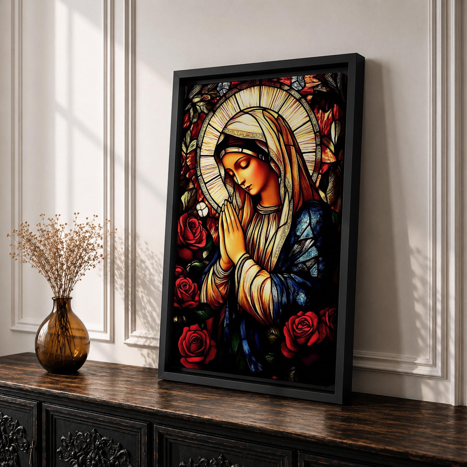 A stained glass style depiction of the Virgin Mary with hands clasped in prayer surrounded by red roses and a radiant halo, rendered in vibrant colors and intricate glass-like textures, evoking a classic religious portrait in a mosaic-inspired visual style.