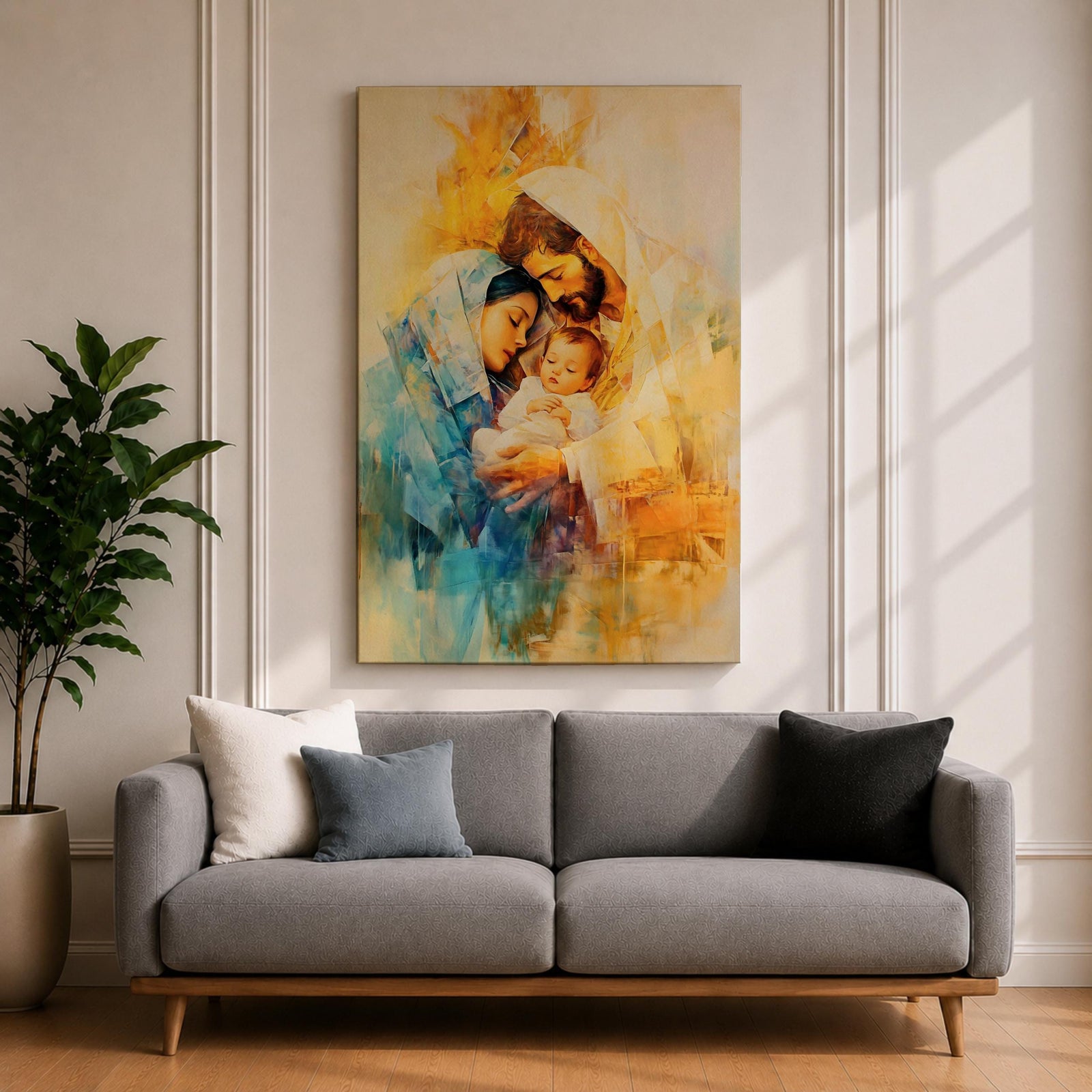 A framed canvas artwork depicting the Holy Family with Mary, Joseph, and baby Jesus in a tender embrace. The painting features warm tones and soft brush strokes, capturing the intimate moment of the Nativity scene with a focus on the figures' expressions and clothing details.