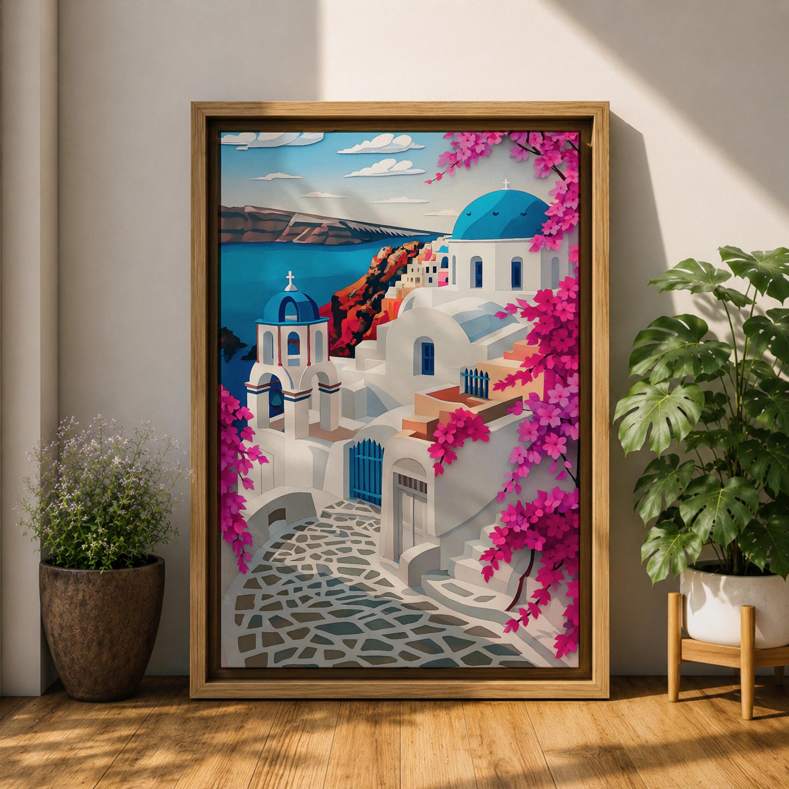 A vibrant framed canvas depicting Santorini, Greece, featuring iconic white buildings with blue domes, winding cobblestone paths, and bright bougainvillea flowers overlooking a deep blue sea, rendered in a clean, graphic style emphasizing architectural shapes and Mediterranean coastal charm.