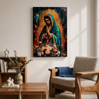 A vibrant framed canvas painting of Our Lady of Guadalupe depicts the Virgin of Guadalupe with hands clasped in prayer, wearing a teal mantle adorned with gold stars and surrounded by radiant light. The foreground features a colorful array of flowers, emphasizing the Catholic religious theme.