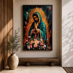 A vibrant framed canvas painting of Our Lady of Guadalupe depicts the Virgin of Guadalupe with hands clasped in prayer, wearing a teal mantle adorned with gold stars and surrounded by radiant light. The foreground features a colorful array of flowers, emphasizing the Catholic religious theme.