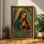 A vintage-style framed canvas depicting Our Lady of Guadalupe with her hands clasped in prayer, wearing a teal mantle adorned with stars and a golden halo radiating behind her. The artwork features intricate floral patterns surrounding the figure, emphasizing traditional Mexican Catholic iconography.