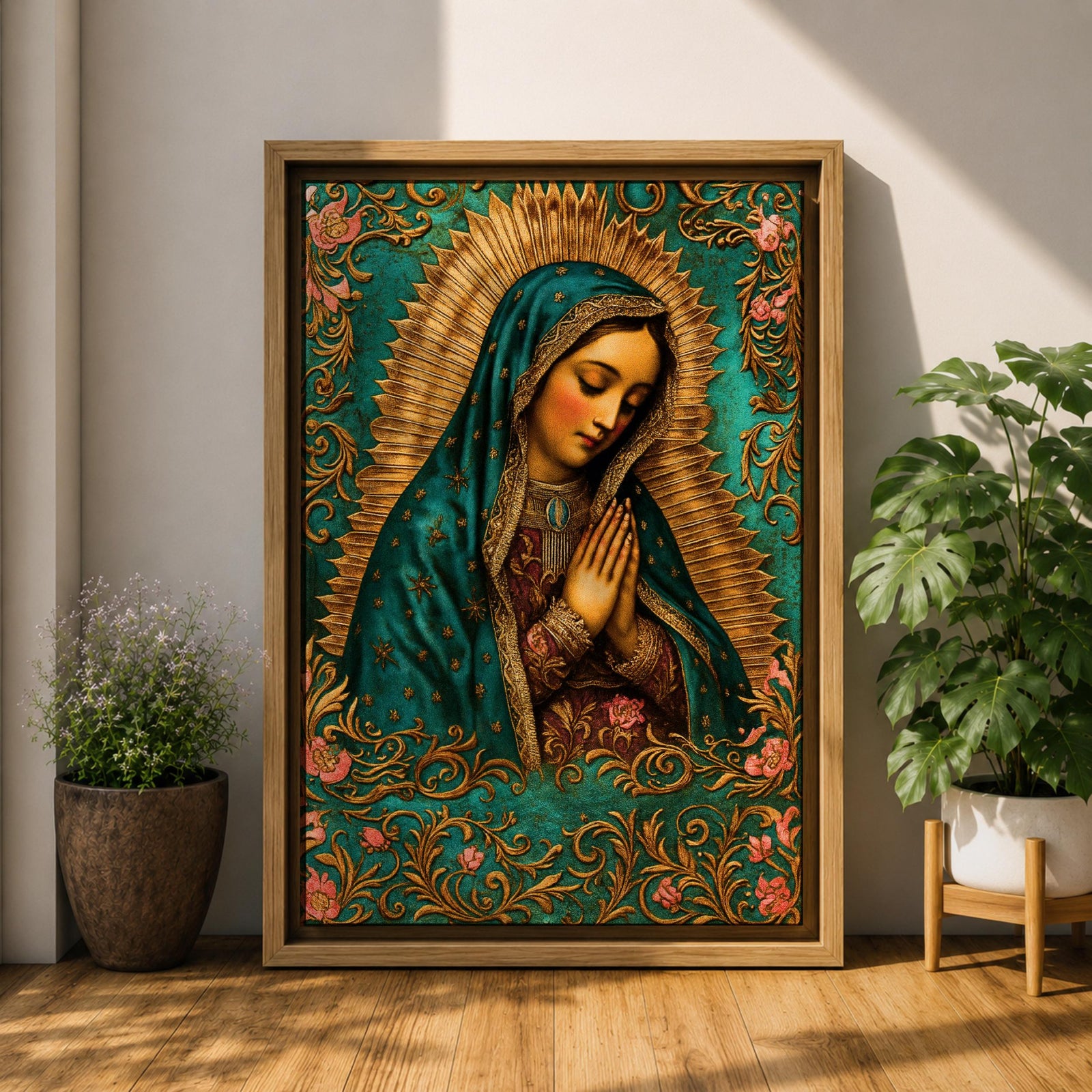 A vintage-style framed canvas depicting Our Lady of Guadalupe with her hands clasped in prayer, wearing a teal mantle adorned with stars and a golden halo radiating behind her. The artwork features intricate floral patterns surrounding the figure, emphasizing traditional Mexican Catholic iconography.