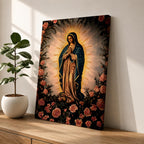 A detailed framed canvas depicting Our Lady of Guadalupe, also known as Virgin of Guadalupe, surrounded by floral motifs. The artwork features a traditional religious figure with a radiant halo and a floral border, rendered in a classic style suitable for Catholic-themed decor.