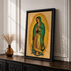 This artwork depicts Our Lady of Guadalupe rendered in a detailed mosaic style with vibrant gold and green tones. The figure is shown with hands clasped in prayer, surrounded by a radiant golden aura, and standing on a crescent moon supported by an angelic face below, capturing the iconic religious imagery.