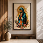 A detailed framed canvas print depicting Our Lady of Guadalupe with hands clasped in prayer, wearing a blue mantle and surrounded by a golden aura and pink roses, rendered in a vibrant, illustrative style emphasizing cultural and religious symbolism.