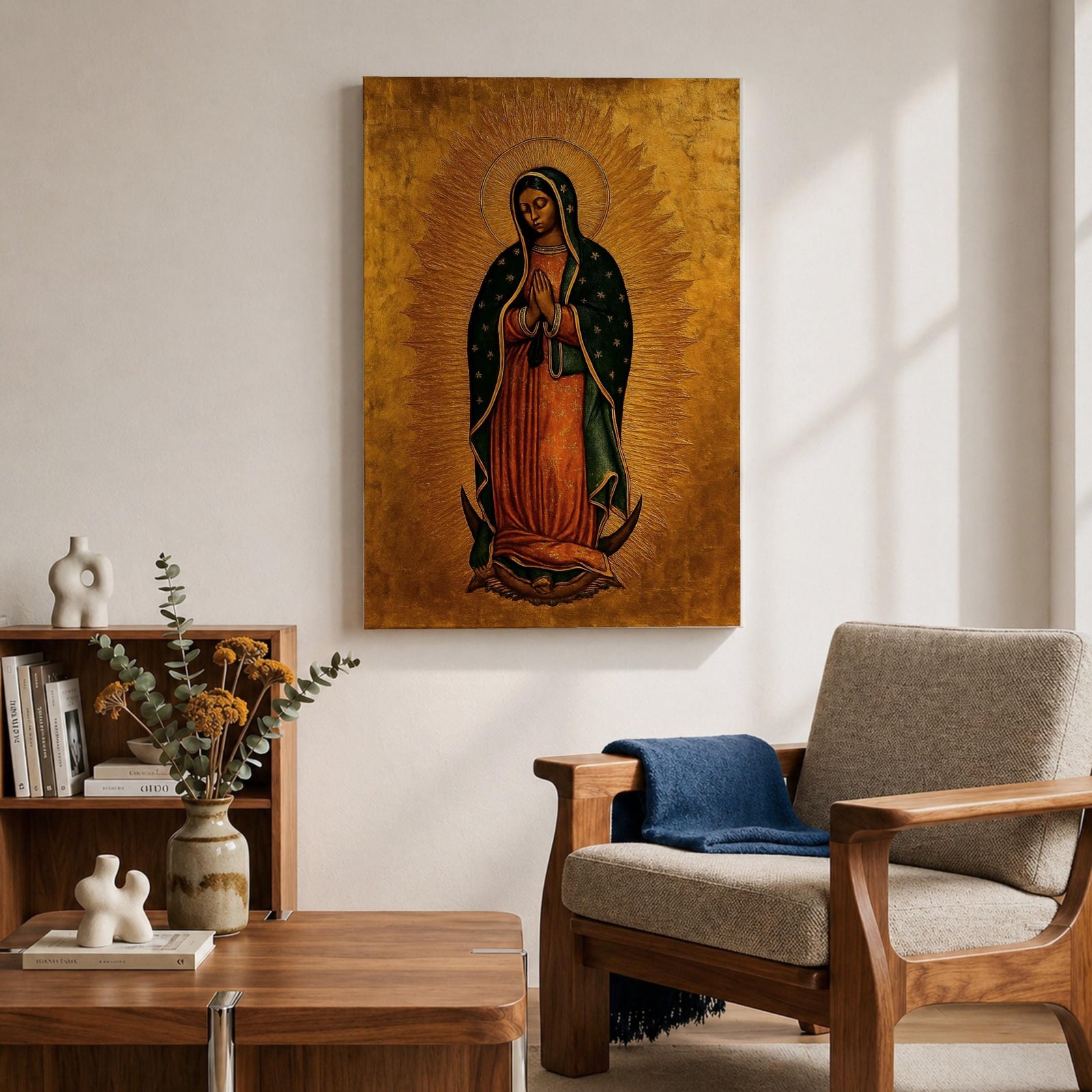 A traditional devotional depiction of Our Lady of Guadalupe standing with hands folded in prayer, wearing a rose colored gown and a teal mantle covered in gold stars, surrounded by radiant golden sun rays and standing above a crescent moon supported by an angel, rendered in classic Mexican Catholic icon style with rich colors and sacred symbolism.
