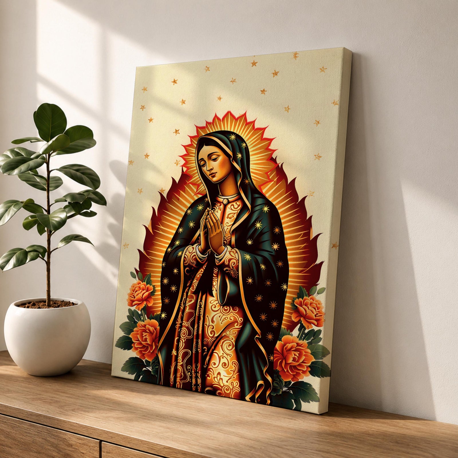 A devotional depiction of Our Lady of Guadalupe standing with hands folded in prayer, wearing a rose pink gown and a teal mantle filled with gold stars, surrounded by radiant golden rays and positioned above a crescent moon with an angel beneath, framed by colorful floral elements in a Mexican Catholic devotional style.