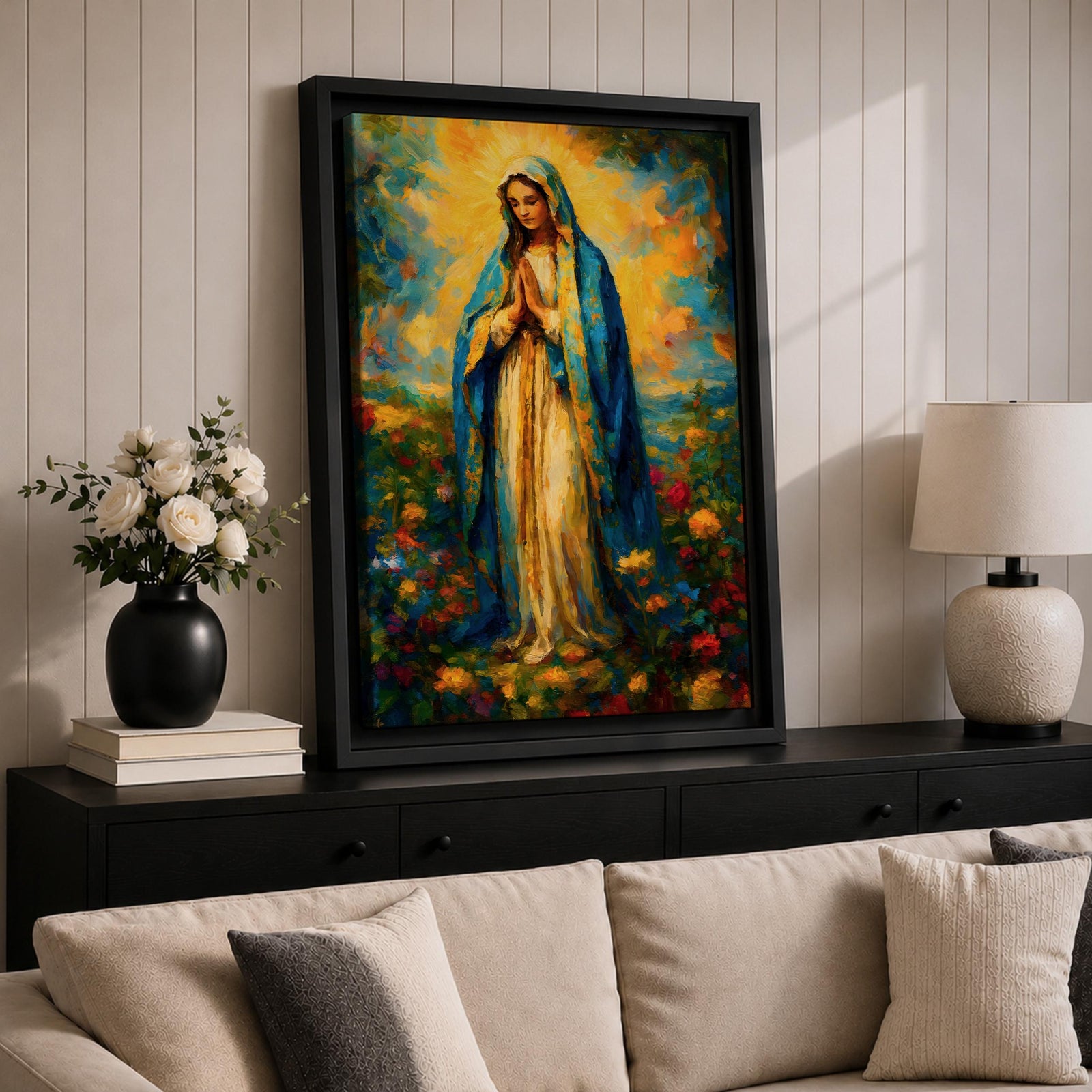 An impressionist style painting of the Virgin Mary standing with hands clasped in prayer, draped in a blue cloak and surrounded by colorful floral elements. The artwork captures a soft, textured brushstroke technique emphasizing spiritual reverence and vibrant natural surroundings.