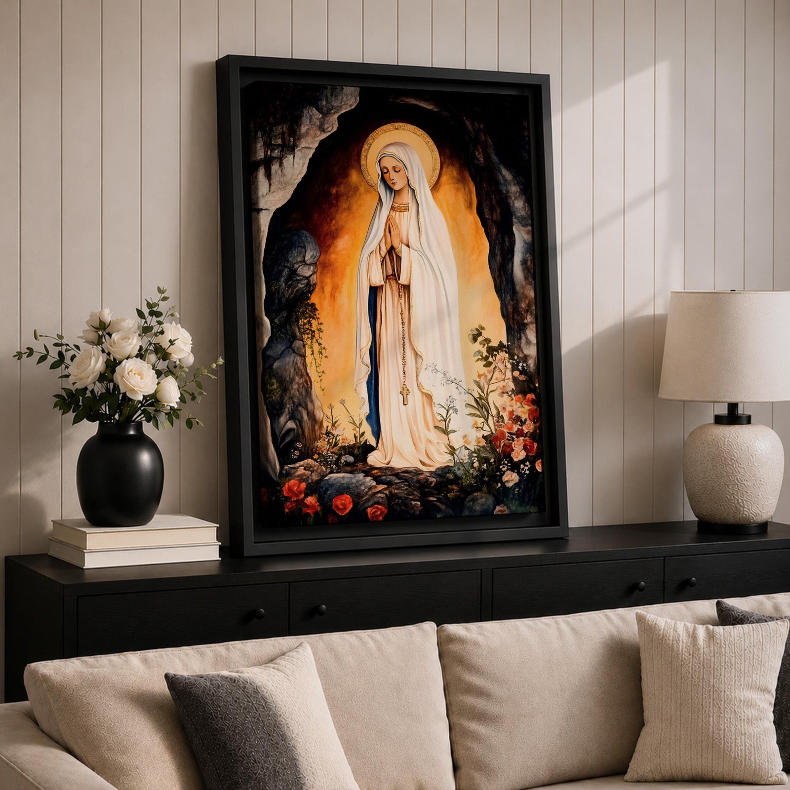 A devotional depiction of Our Lady of Lourdes standing in prayer within a rocky grotto, wearing a flowing white robe with a pale blue sash and veil, hands clasped and eyes gently lowered, with delicate roses near her feet and soft radiant light surrounding the figure, rendered in traditional Catholic Marian devotional style.