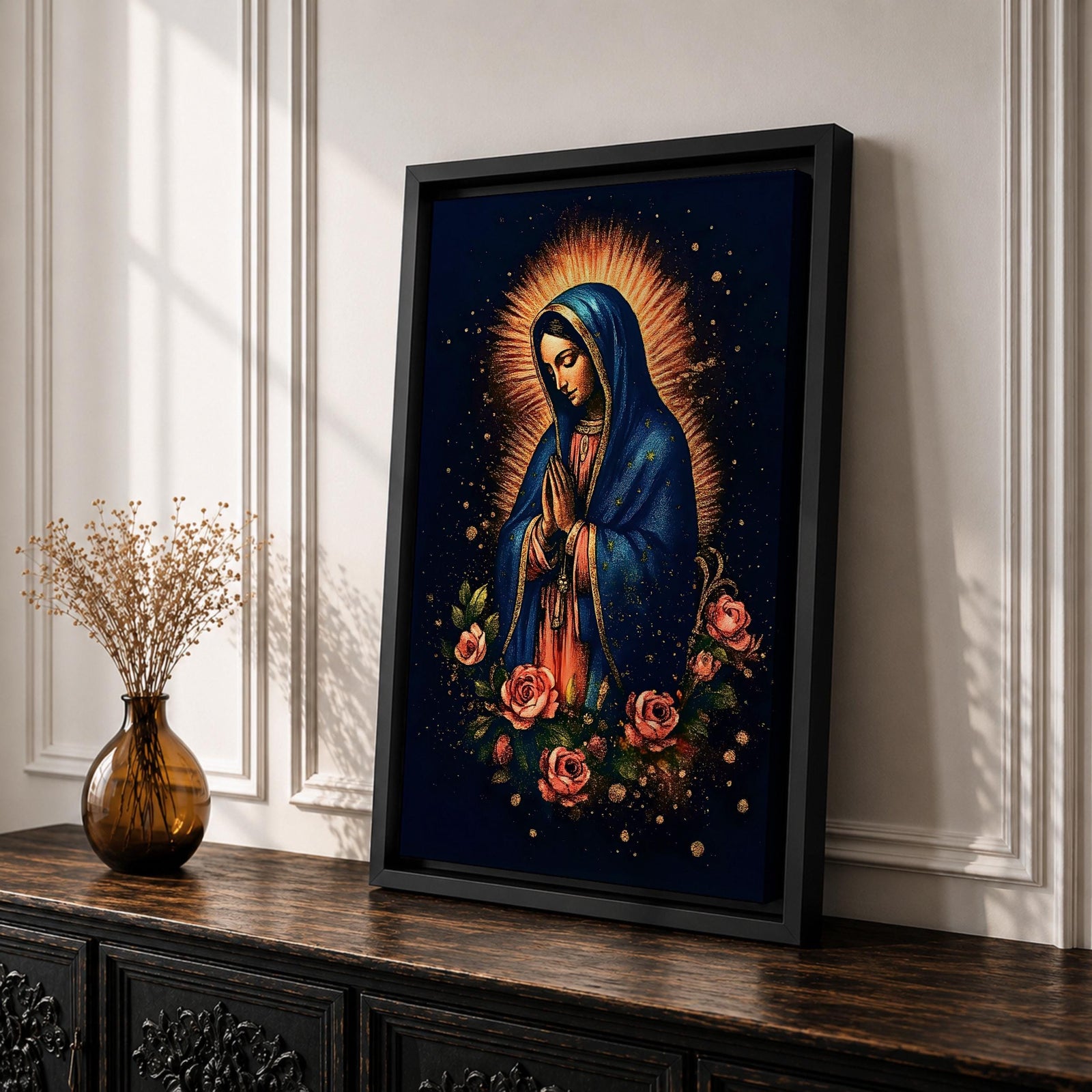 Illustration of Our Lady of Guadalupe standing with hands clasped in prayer, wearing a rose colored gown and star covered teal mantle surrounded by radiant golden rays, framed by decorative floral elements, rendered in warm tones with soft shading in a modern devotional style inspired by traditional Mexican Catholic imagery.