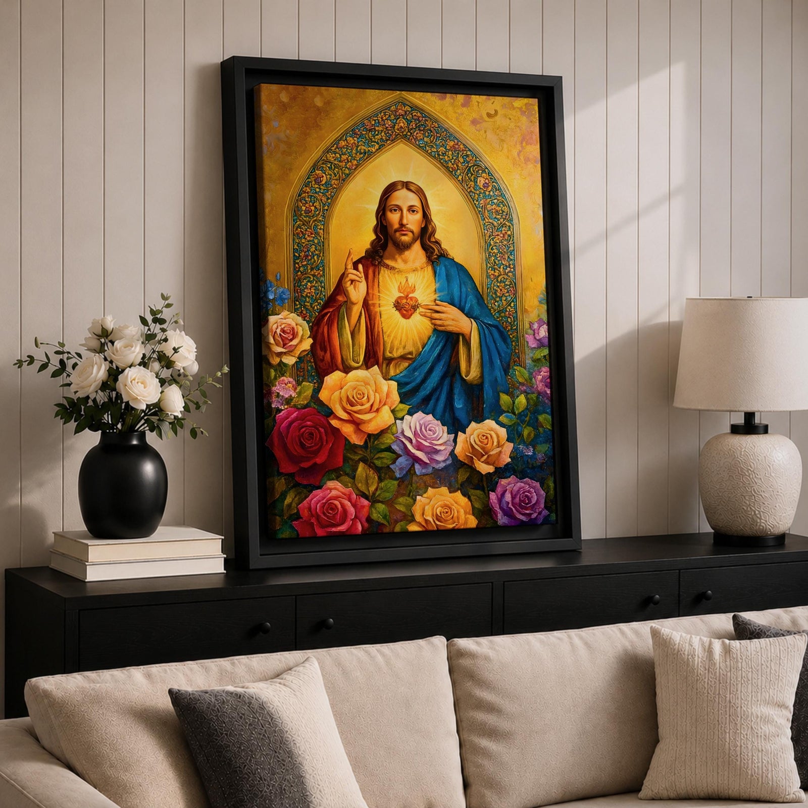 Illustration of Jesus Christ displaying the Sacred Heart glowing from his chest, shown with a calm expression and one hand raised in blessing while the other points toward the radiant heart, surrounded by floral elements and soft light, rendered with clean lines and gentle shading in a modern Christian devotional composition.