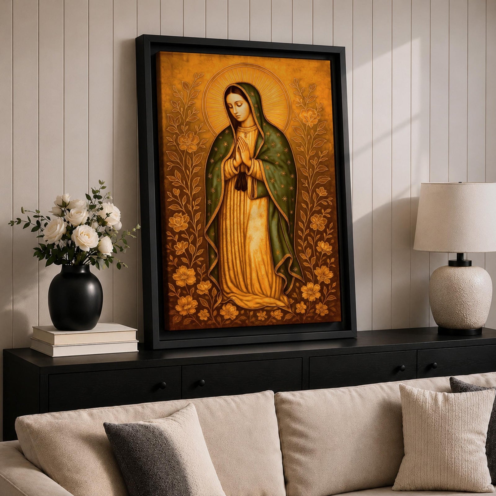 Illustration of Our Lady of Guadalupe also known as La Virgen Morena standing with hands clasped in prayer, wearing a rose colored gown and a teal mantle covered with gold stars, surrounded by radiant golden rays and decorative floral elements, with a small angel beneath her, rendered with soft shading in a devotional style inspired by Mexican Catholic iconography.