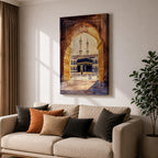Watercolor-style artwork of the Kaaba at Masjid Al Haram in Mecca viewed through a grand mosque archway with open golden doors and pilgrims gathered in the courtyard beneath tall minarets.