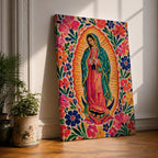 Our Lady of Guadalupe wall art featuring the Virgin Mary in prayer surrounded by vibrant floral folk art patterns and a radiant golden aura. Bright pink, blue, orange, and red blossoms frame this colorful Mexican Catholic artwork, creating a joyful devotional centerpiece for home décor.