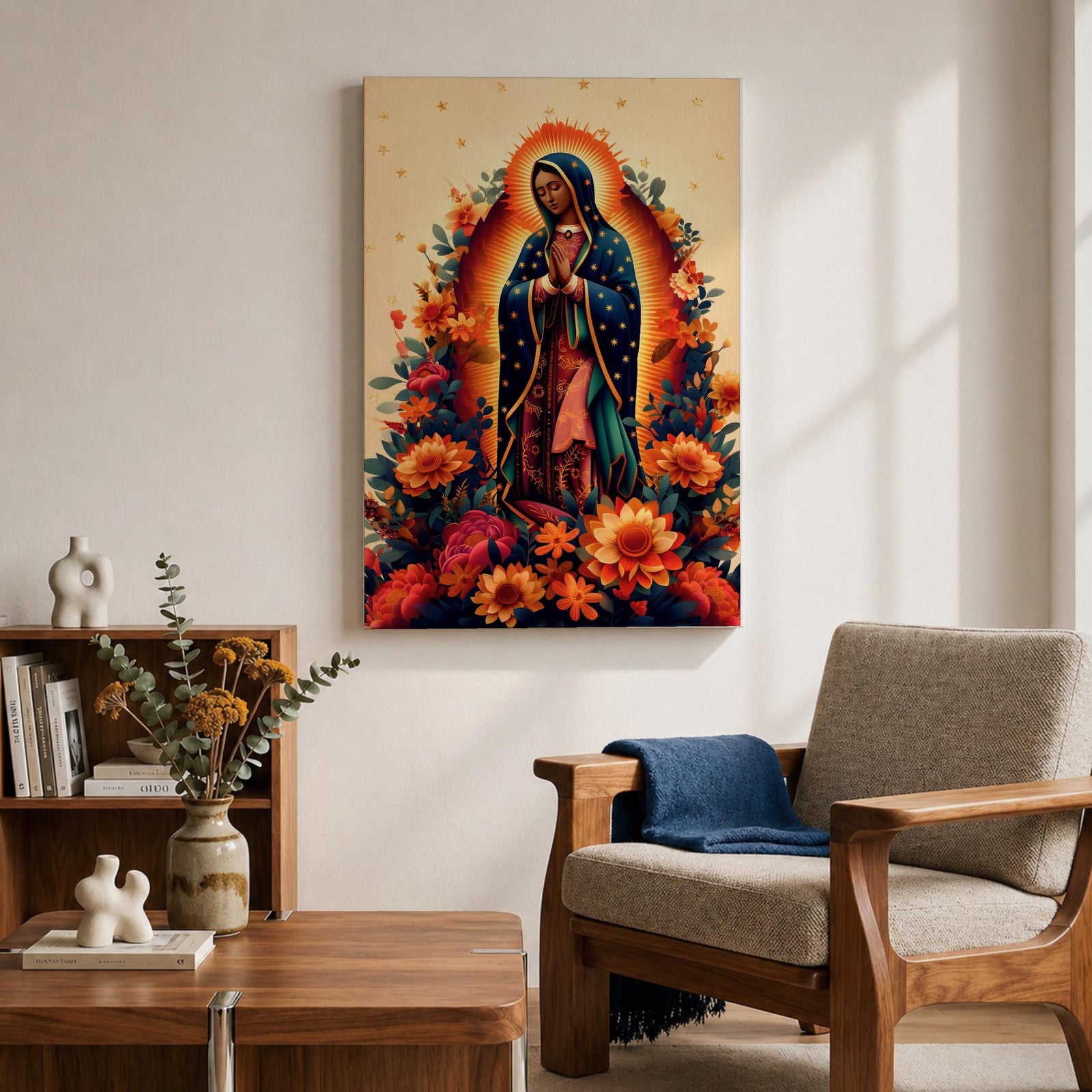 A devotional depiction of La Guadalupana as Our Lady of Guadalupe standing with hands clasped in prayer, wearing a rose pink gown and a teal mantle covered with gold stars, surrounded by radiant golden rays and standing above a crescent moon with an angel beneath, framed with floral elements in traditional Mexican Catholic style.