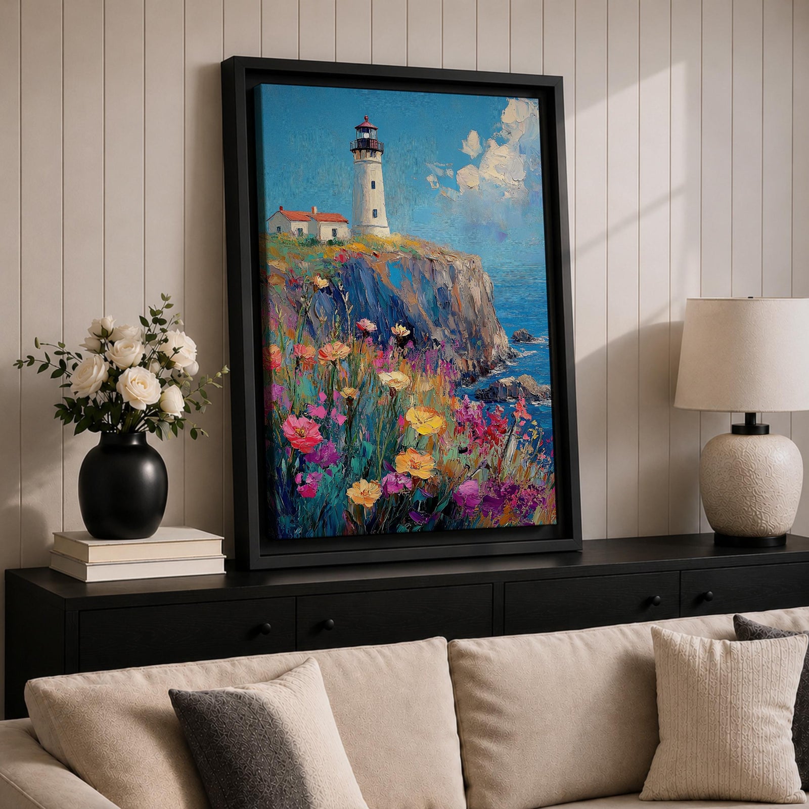 This impasto style painting depicts a lighthouse standing on a rocky cliff overlooking the sea with a vibrant wildflower meadow in the foreground. The thick textured brushstrokes create a rich, colorful coastal landscape scene with blue skies and scattered clouds.